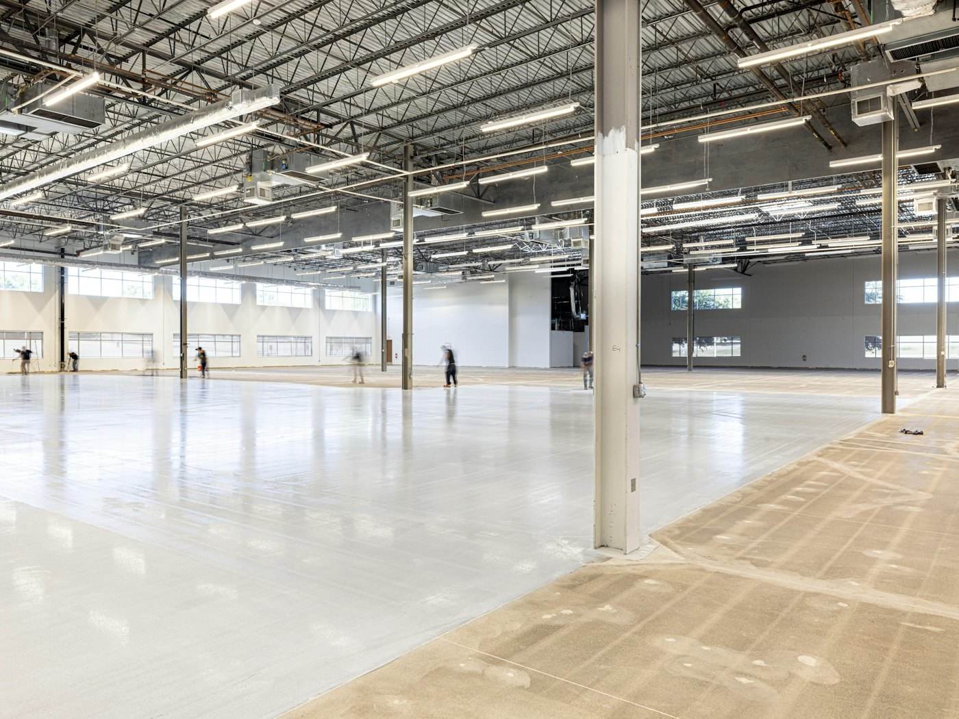 Empty commercial shell with a polished concrete floor, ready for build-out